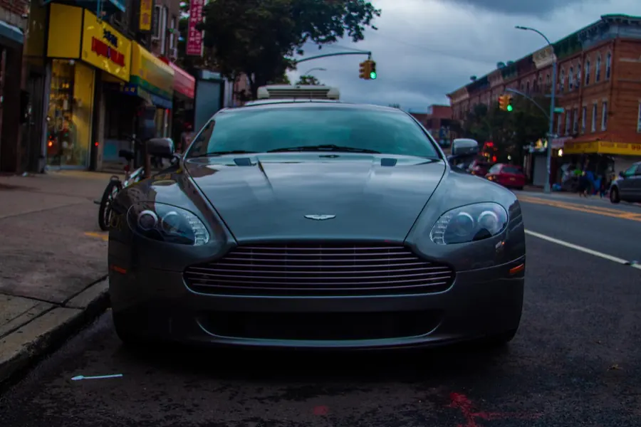Grey Aston Martin Vantage parked on a Brooklyn avenue
